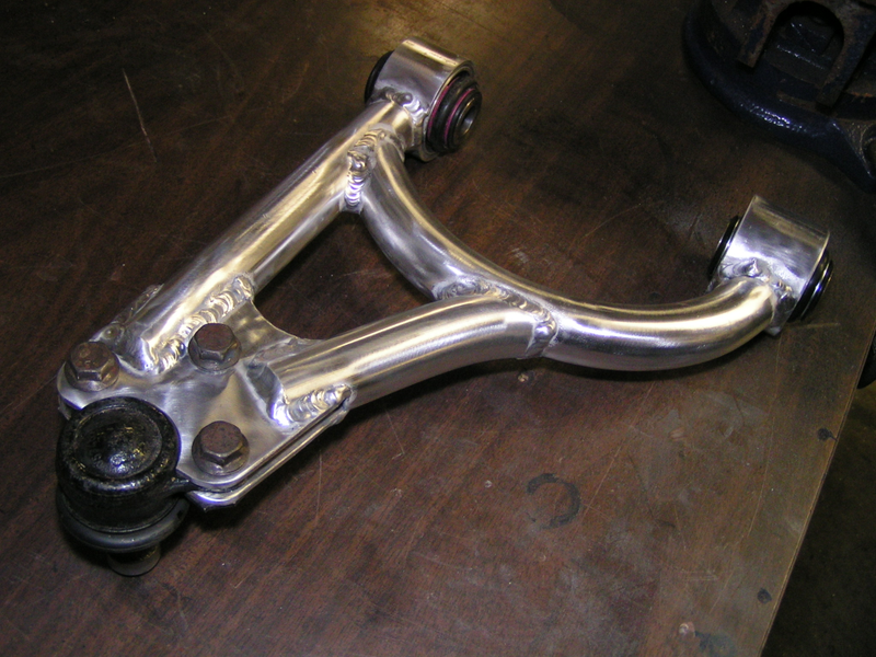 The original rear upper control arms, which weighed only around 600 grams. They’re beautiful, but they weren’t sturdy enough in use.